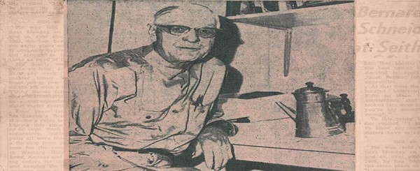 Old man in news paper